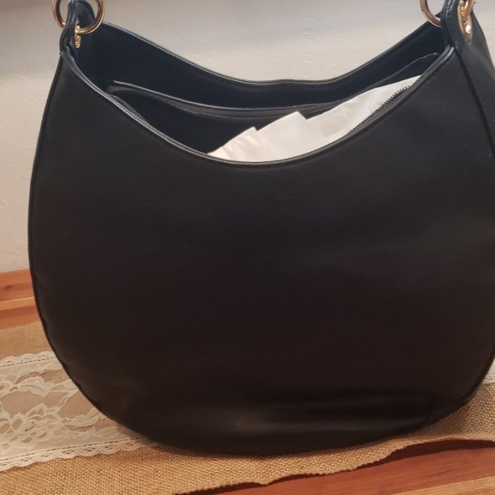 New Leather black purse from Macy's Perfect for everyday use great Quality...